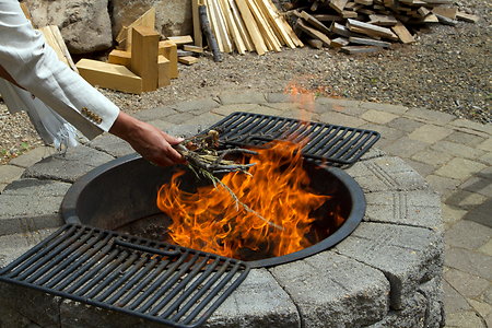 Fire Ceremonies and Earth Offerings. Pachamama stick in fire
